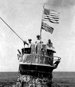 U.S. naval officers on the conning tower of the captured German submarine U-505, in June 1944 (NH 10585) photo