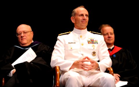 U.S. Navy Adm. Jonathan W. Greenert, center, the Chief of Naval Operations, listens to the opening remarks during a graduation ceremony at the U.S. Naval War College in Newport, R.I., June 21, 2013 130621-N-PX557-161