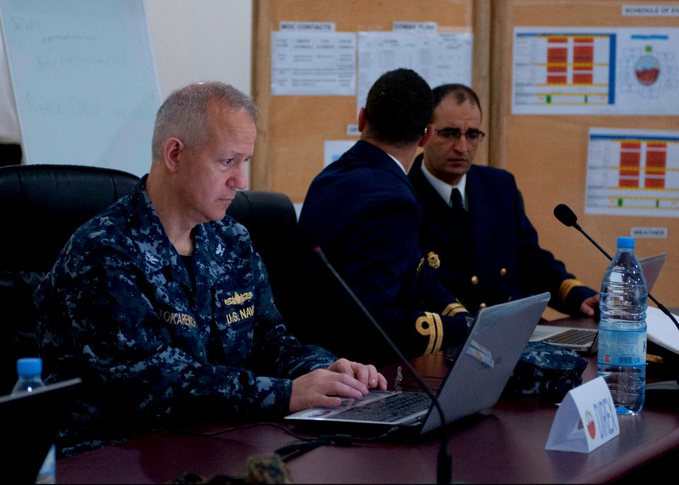 U.S. Navy Capt. John Tokarewich, left, the exercise director of Saharan Express 2014, Royal Moroccan Navy Lt. Jawad Lakziz, a liaison officer, and Royal Moroccan Navy Cmdr. Dargham Redouane, the exercise control 140310-N-QY759-010