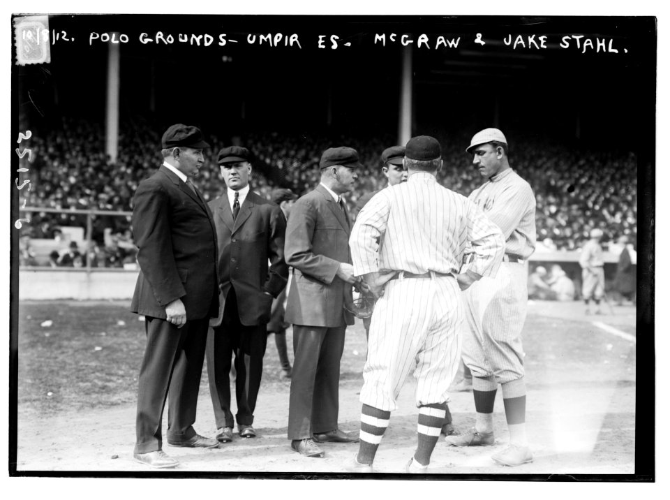 Umpires with managers John McGraw (back to camera), New York NL, and Jake Stahl, Boston AL, first game of 1912 World Series (baseball) LCCN2014691732