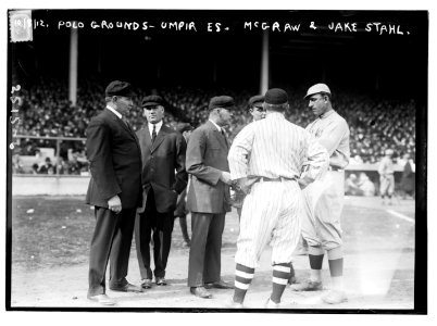 Umpires with managers John McGraw (back to camera), New York NL, and Jake Stahl, Boston AL, first game of 1912 World Series (baseball) LCCN2014691732