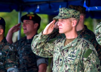 U.S. Navy Cmdr. Jeffrey V. Morganthaler, the commanding officer ashore of Southern Partnership Station (SPS) 2014, salutes during the closing ceremony for SPS 2014 in Puerto Barrios, Guatemala, Aug. 22, 2014 140822-N-XQ474-091