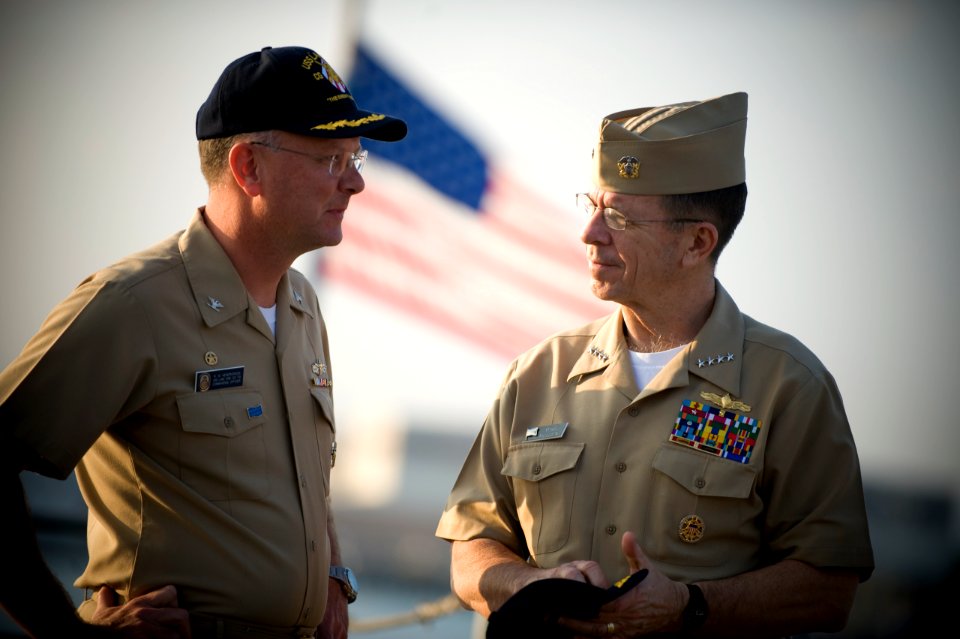 U.S. Navy Capt. Randall M. Hendrickson, left, speaks with Navy Adm. Mike Mullen