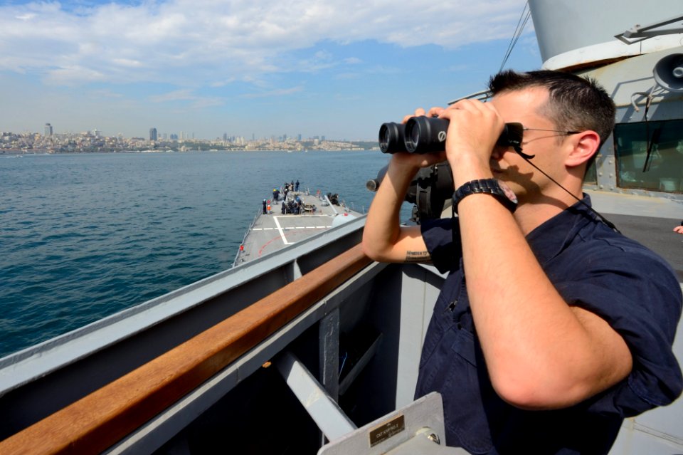 U.S. Navy Ensign Shea Miller stands watch aboard the guided missile destroyer USS Ross (DDG 71) while transiting the Bosporus en route to the Black Sea Sept 140903-N-IY142-189