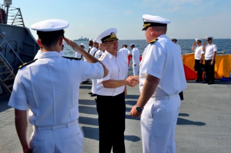 Ukrainian navy Vice Adm. Serhiy Hayduk, center, the commander in chief of the Ukrainian Naval Forces, exchanges greetings with U.S. Navy Cmdr. Tadd Gorman, the commanding officer of the guided missile destroyer 140908-N-IY142-151