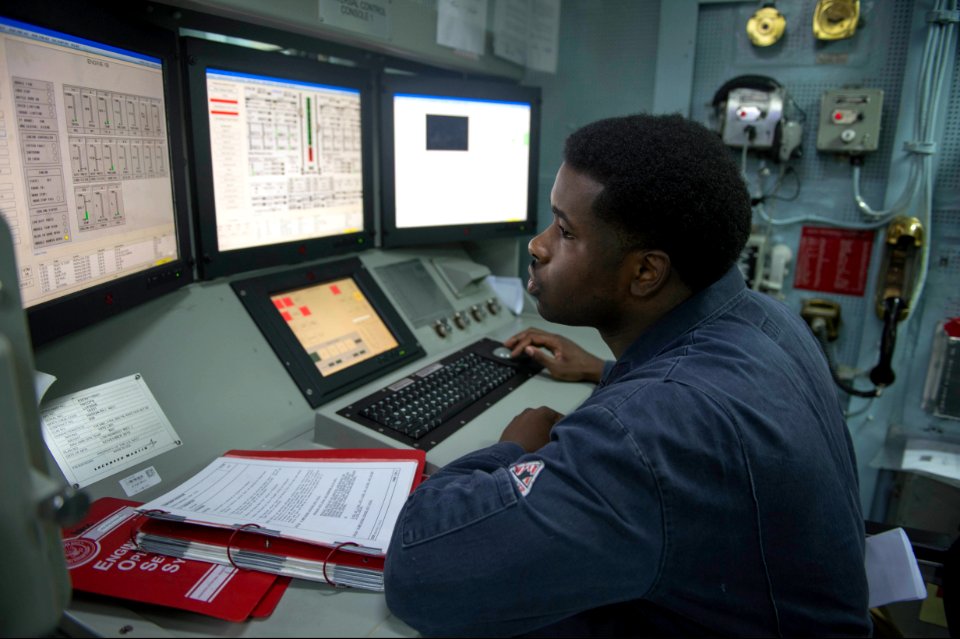 U.S. Navy Gas Turbine System Technician (Mechanical) 2nd Class Quazavier Henderson monitors the engineering systems during a basic engineering casualty control exercise Jan. 15, 2014, in the central control 140115-N-UD469-377