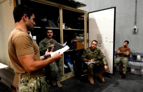U.S. Navy Chief Hull Maintenance Technician Mario Pais, left, assigned to an unmanned underwater vehicle team with Commander, Task Group (CTG) 56 140209-N-OU681-014