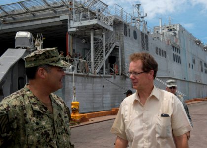 U.S. Navy Capt. Sam Hancock, left, the mission commander for Southern Partnership Station (SPS) 2014 operations aboard the joint high speed vessel USNS Spearhead (JHSV 1), speaks to U.S. Ambassador to Honduras 140901-N-QY430-079