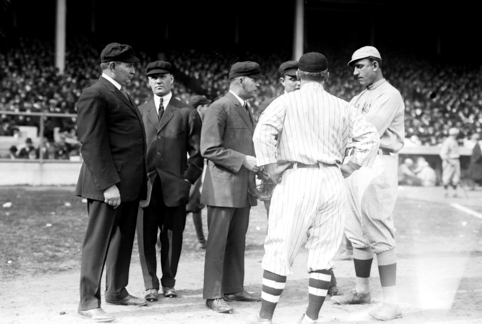 Umpires with managers John McGraw (back to camera), New York NL, and Jake Stahl, Boston AL, first game of 1912 World Series (baseball) LCCN2014691732 (cropped)