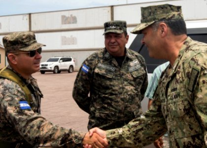 U.S. Navy Capt. Sam Hancock, right, the mission commander for Southern Partnership Station (SPS) 2014 operations aboard the joint high speed vessel USNS Spearhead (JHSV 1), greets Honduran military officials 140901-N-QY430-100