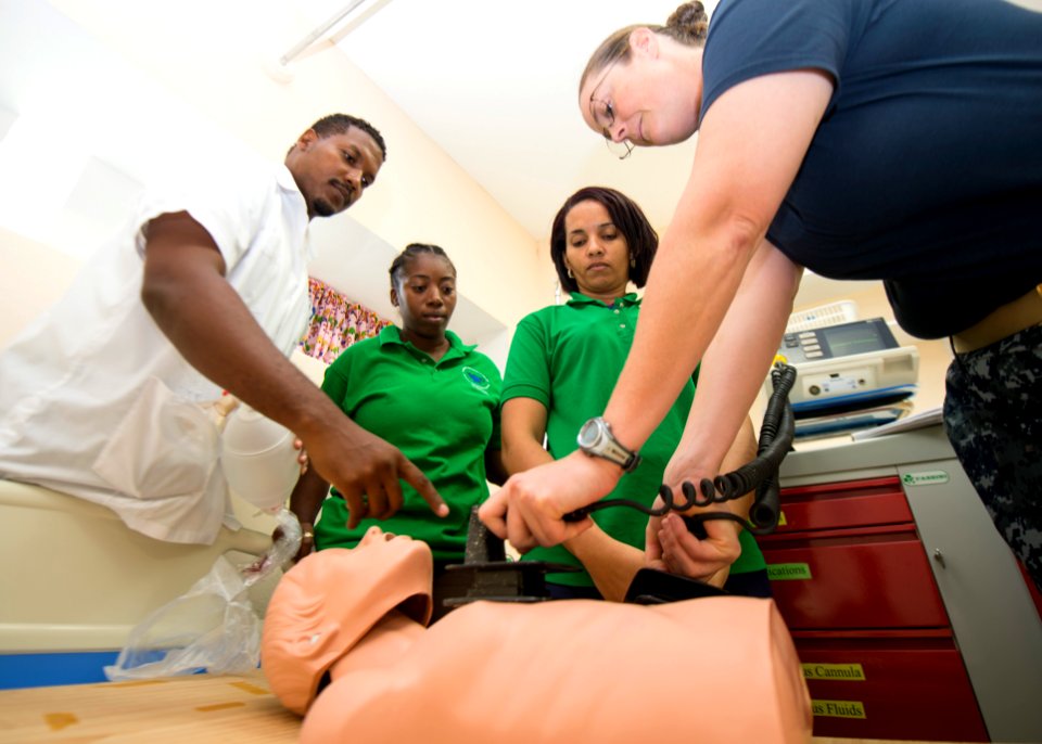 U.S. Navy Lt. Cmdr. Suzanne Maldarelli, right, a medical officer, conducts a subject matter expert exchange on advanced cardiac life support with nurses at a hospital in Toledo, Belize, June 27, 2014, during 140627-N-XQ474-071