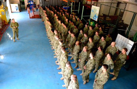 U.S. Navy Cmdr. Keith Dowling, left, the commander of Task Force (CTF) 56, talks to his Sailors during awards quarters at Naval Support Activity Bahrain in Manama, Bahrain, Feb. 13, 2014 140213-N-OU681-026
