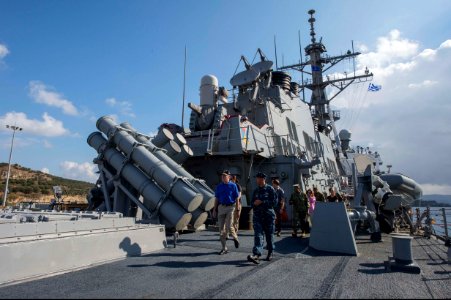 U.S. Navy Cmdr. Dave Stoner, center, the commanding officer of the guided missile destroyer USS Ramage (DDG 61), escorts Secretary of the Navy Ray Mabus, left, on a tour of the ship Nov. 15, 2013, at Naval 131115-N-VC236-087