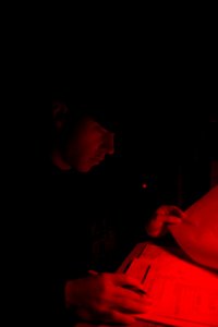 U.S. Navy Ensign Michael Crawford reviews the sea and anchor checklist on the bridge aboard the guided missile destroyer USS Stout (DDG 55) in the Mediterranean Sea as the ship prepares to pull into Haifa 140119-N-UD469-023