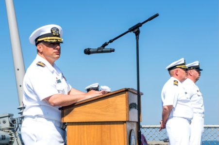 U.S. Navy Cmdr. Tadd Gorman, the commanding officer of the guided missile destroyer USS Ross (DDG 71), talks about the importance of remembrance and sacrifice during a 9-11 remembrance ceremony Sept 140911-N-IY142-018