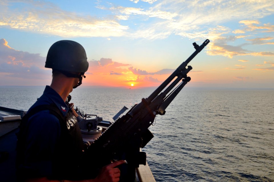 U.S. Navy Gunner's Mate 2nd Class Kent Ferguson stands watch aboard the guided missile destroyer USS Ross (DDG 71) in the Dardanelles en route to the Black Sea Sept 140903-N-IY142-024