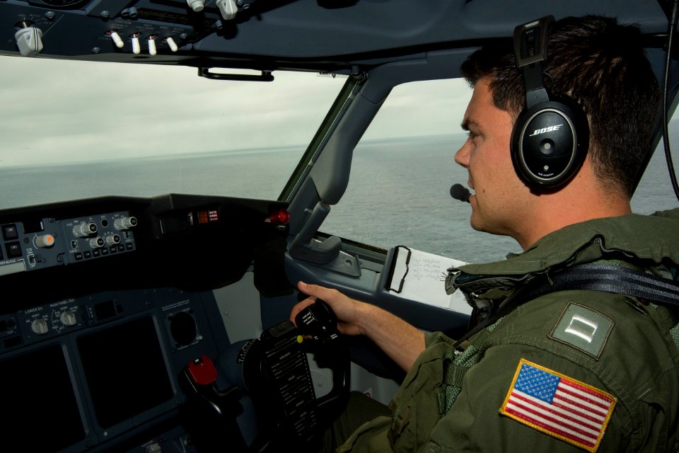 U.S. Navy Lt. Mike Glynn, a naval aviator assigned to Patrol Squadron (VP) 16, pilots a P-8A Poseidon aircraft over the Indian Ocean April 15, 2014, during a search mission in support of the international effort 140415-N-VD564-012