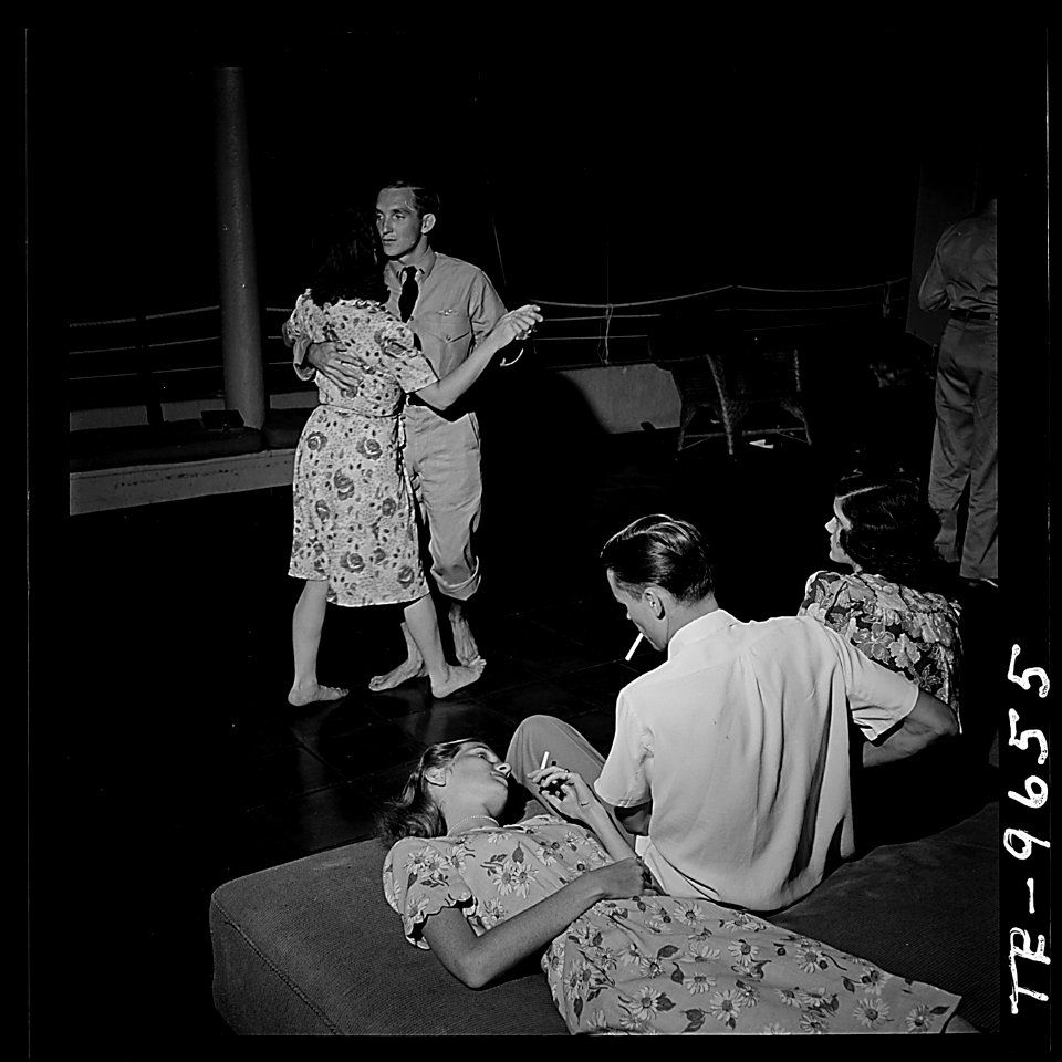 U.S. Navy pilots relax and enjoy feminine companionship, sports and entertainment at Chris Holmes Rest Home... - NARA - 520963