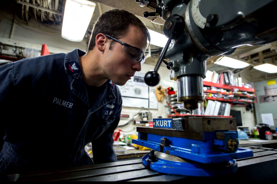 U.S. Navy Machinery Repairman 2nd Class James Palmer fabricates a lock hasp in the general workshop aboard the guided missile destroyer USS Ramage (DDG 61) Dec. 1, 2013, at Naval Support Activity Souda Bay 131201-N-VC236-008