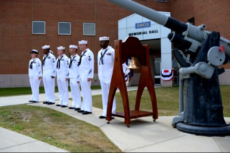 U.S. Navy Operations Specialist 1st Class Gerald Crawford, assigned to the U.S. Naval War College, rings a bell during a 9-11 commemoration ceremony at Naval Station Newport, R.I., Sept 140911-N-PX557-204
