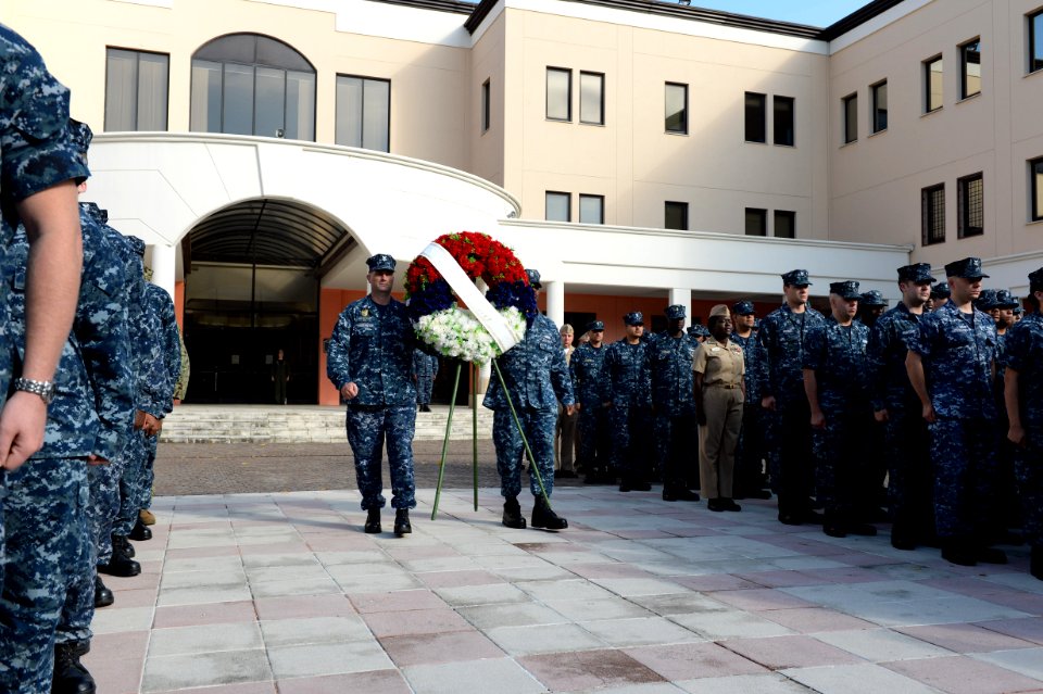 U.S. Navy petty officers first class selected to be chief petty officers walk with a memorial wreath as part of a 9-11 memorial ceremony Sept 140911-N-QY759-091