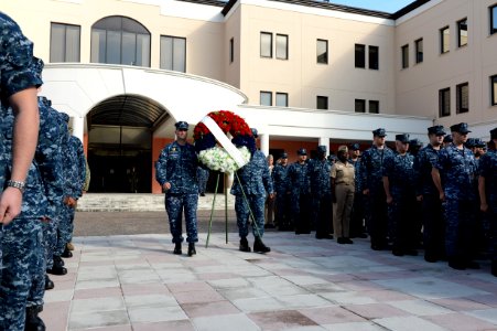 U.S. Navy petty officers first class selected to be chief petty officers walk with a memorial wreath as part of a 9-11 memorial ceremony Sept 140911-N-QY759-091