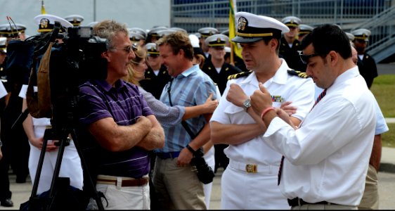 U.S. Navy Lt. Cmdr. Douglas High, second from right, the executive officer of U.S. Naval War College Public Affairs Reserve Component, speaks to journalists during a 9-11 commemoration ceremony at Naval Station 140911-N-PX557-065