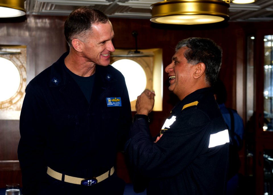 U.S. Navy Rear Adm. Bill Byrne and Indian Navy Rear Admiral Biswajit Dasgupta, talk during an admiral visit aboard the USS Nimitz (CVN 68) as part of the conclusion of Malabar 2017