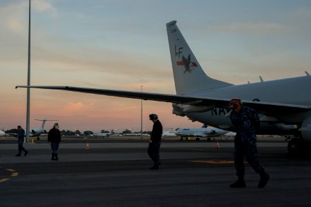 U.S. Navy maintenance crew members assigned to Patrol Squadron (VP) 16 conduct a foreign object debris walk down around a P-8A Poseidon aircraft at Perth Airport in Perth, Australia, April 4, 2014 140404-N-VD564-002