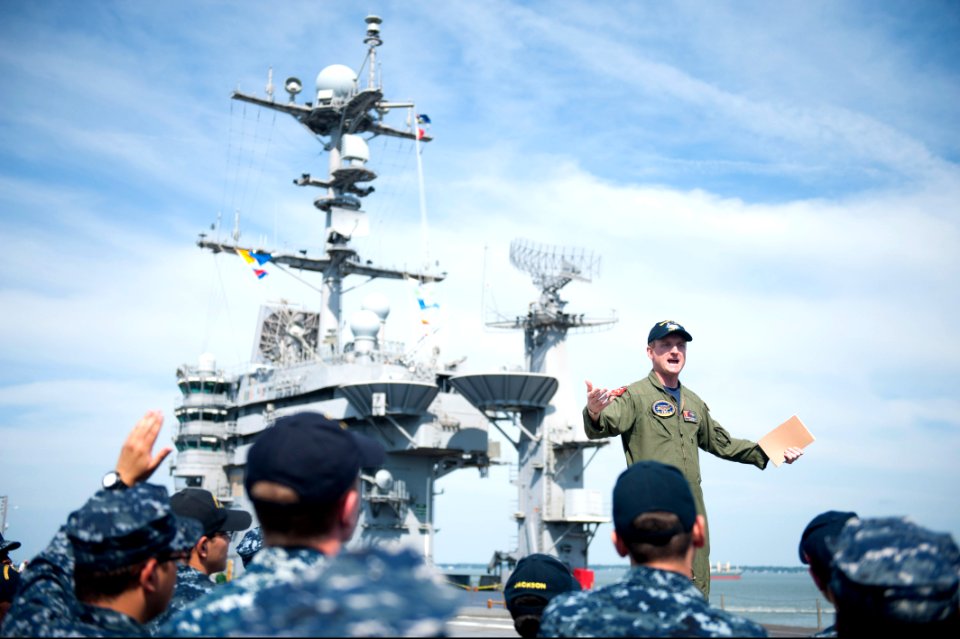 U.S. Navy Lt. Tommy McDonald, top, addresses Sailors assigned to the aircraft carrier USS Harry S. Truman (CVN 75) during a 9-11 remembrance ceremony at Naval Station Norfolk, Va., Sept 140911-N-ZG705-041