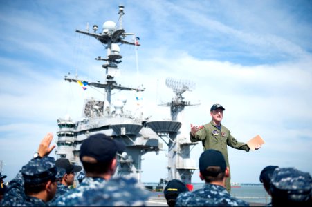 U.S. Navy Lt. Tommy McDonald, top, addresses Sailors assigned to the aircraft carrier USS Harry S. Truman (CVN 75) during a 9-11 remembrance ceremony at Naval Station Norfolk, Va., Sept 140911-N-ZG705-041 photo