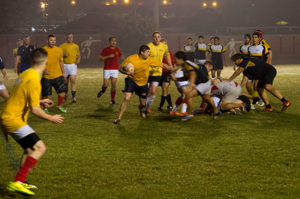 U.S. Sailors and Marines assigned to the amphibious assault ship USS America (LHA 6) and Peruvian sailors play rugby in Callao, Peru, Sept 140901-N-MZ309-250