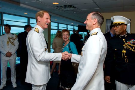 U.S. Navy Vice Adm. Mike Miller, foreground left, the superintendent of the U.S. Naval Academy, welcomes Chief of Naval Operations Adm. Jonathan W. Greenert, foreground right, to the flag bridge May 24, 2013 130524-N-WL435-002