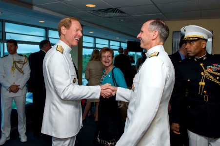 U.S. Navy Vice Adm. Mike Miller, foreground left, the superintendent of the U.S. Naval Academy, welcomes Chief of Naval Operations Adm. Jonathan W. Greenert, foreground right, to the flag bridge May 24, 2013 130524-N-WL435-002 photo