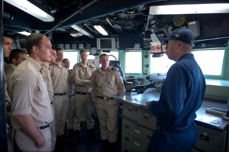 U.S. Navy Quartermaster 1st Class Jose Perez, right, gives Israeli Naval Forces sailors a tour of the bridge of the guided missile destroyer USS Stout (DDG 55) in Haifa, Israel, Jan. 20, 2014, during a scheduled 140120-N-UD469-345