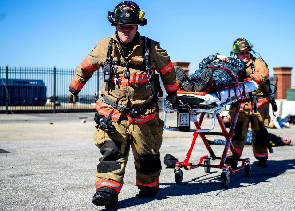 U.S. Navy firefighters treat a simulated casualty Feb. 27, 2014, during a vehicle-borne improvised explosive device response exercise as part of Solid Curtain-Citadel Shield (SC-CS) 2014 at Naval Station 140227-N-XQ474-238