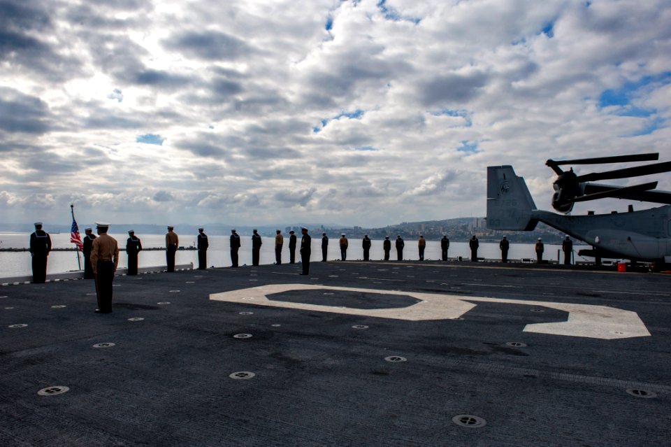 U.S. Sailors and Marines man the rails as the amphibious assault ship USS America (LHA 6) departs Valparaiso, Chile, Aug. 27, 2014, after a three-day port visit 140827-N-MZ309-046