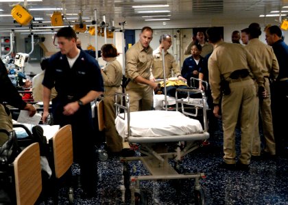 US Navy 030315-N-4048T-123 Medical personnel attend to patients in one of the medical triage rooms aboard the amphibious assault ship USS Kearsarge (LHD 3) photo