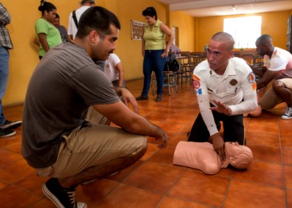 U.S. Navy Hospital Corpsman 2nd Class Alonso Garcia, left, conducts a subject matter expert exchange on CPR during Southern Partnership Station (SPS) 2014 in Morales, Guatemala, Aug. 17, 2014 140817-N-QY430-090