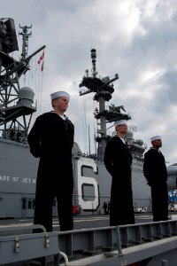 U.S. Sailors assigned to the amphibious assault ship USS America (LHA 6) man the rails as the ship leaves Valparaiso, Chile, Aug. 27, 2014 140827-N-MZ309-015