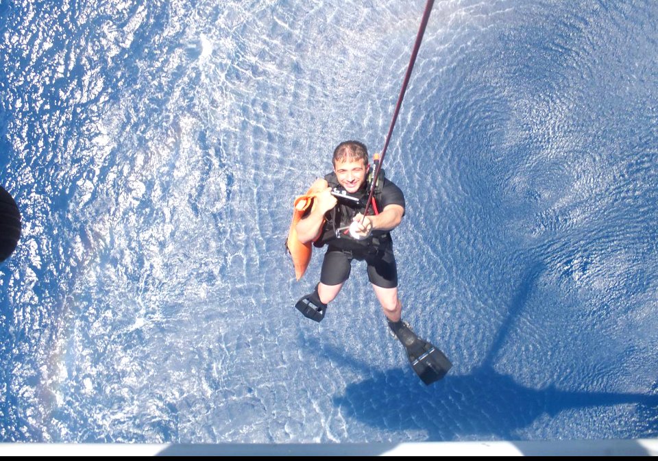 U.S. Navy Naval Aircrewmen 2nd Class Clayton Wirth, a rescue swimmer with Detachment 1, Helicopter Maritime Strike Squadron (HSM) 78, pulls a life jacket from the Gulf of Thailand March 11, 2014, during Malaysia 140311-N-ZZ999-005