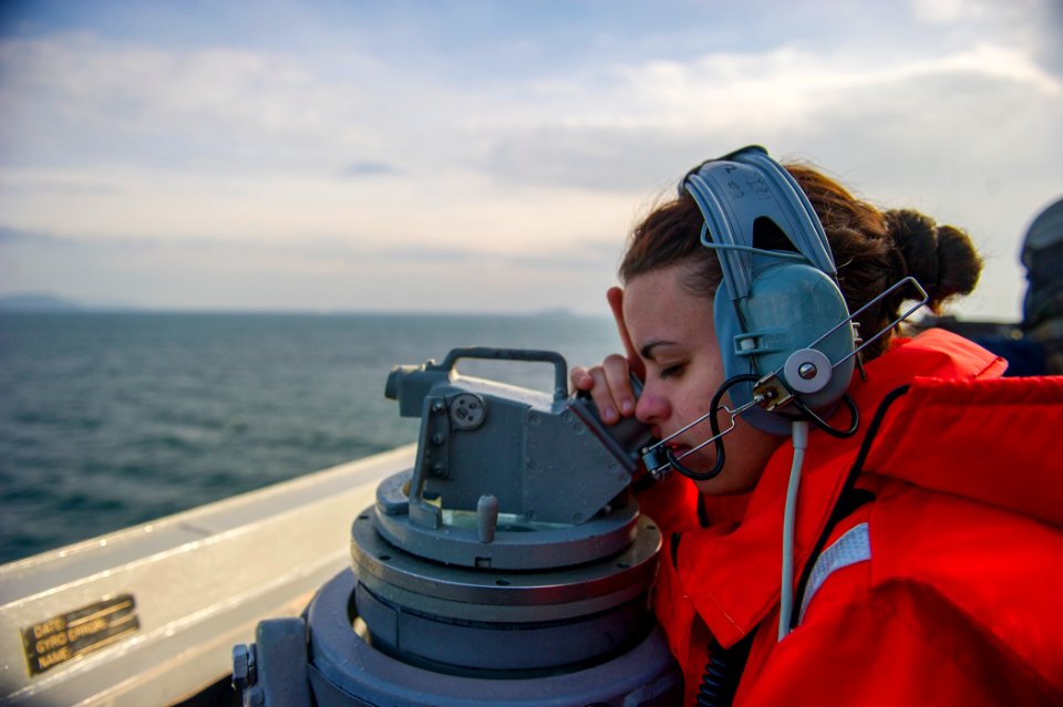 U.S. Navy Quartermaster Seaman Nicole Cyr stands watch aboard the guided missile destroyer USS Truxtun (DDG 103) as the ship transits the Bosphorus strait March 7, 2014 140307-N-EI510-082