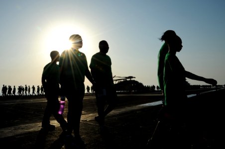 U.S. Sailors participate in a suicide awareness walk on the flight deck of the aircraft carrier USS George H.W. Bush (CVN 77) in the Persian Gulf Sept 140921-N-MU440-135