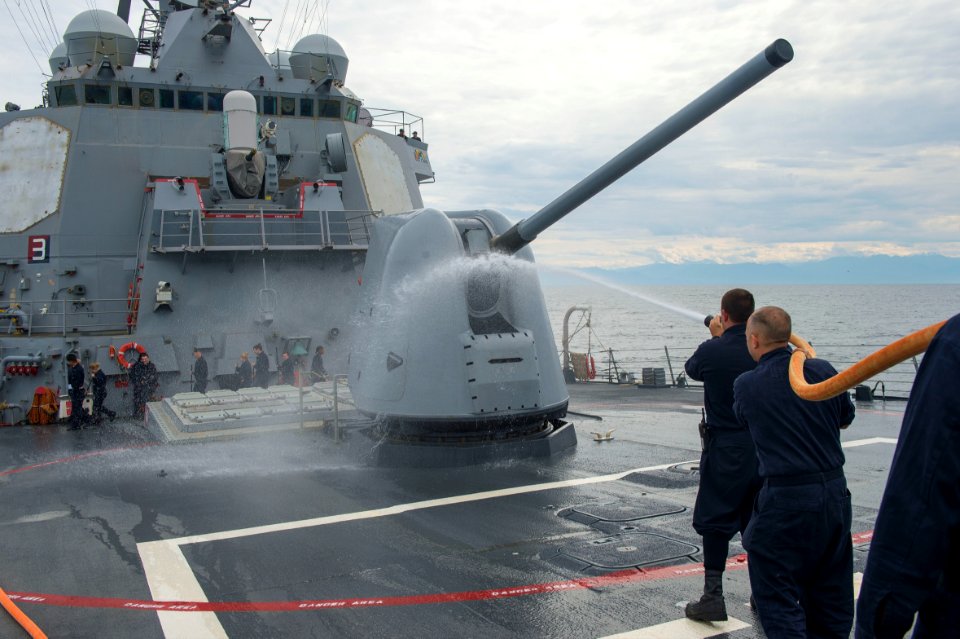 U.S. Sailors conduct a fresh-water washdown aboard the guided-missile destroyer USS Cole (DDG 67) in the Black Sea Oct. 18, 2014 141018-N-IY142-182