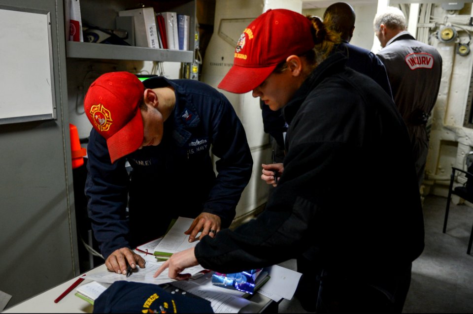 U.S. Sailors aboard the amphibious transport dock ship USS Mesa Verde (LPD 19) write down discrepancies during a ballast demonstration as part of the ship's Board of Inspection and Survey (INSURV) evaluation 140116-N-BD629-172