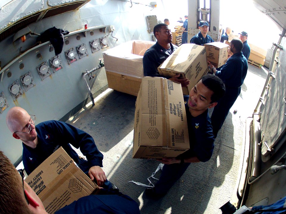 U.S. Sailors aboard the guided missile destroyer USS Ramage (DDG 61) move supplies during a replenishment at sea in the Mediterranean Sea Feb. 22, 2014 140222-N-CH661-202