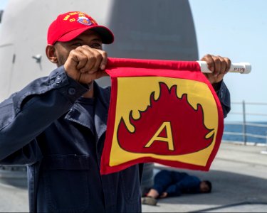 U.S. Navy Ship's Serviceman 1st Class Lashawn Locklear, left, and Hospitalman Taylor Winkey participate in a fire and medical casualty drill aboard the guided missile cruiser USS Philippine Sea (CG 58) in 140405-N-PJ969-029