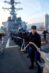 U.S. Sailors aboard the guided missile destroyer USS Stout (DDG 55) heave mooring lines as the ship pulls into port in Haifa, Israel, Jan. 19, 2014, for a scheduled port visit 140119-N-UD469-558