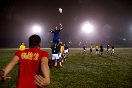 U.S. Sailors and Marines assigned to the amphibious assault ship USS America (LHA 6) and Peruvian sailors play rugby in Callao, Peru, Sept 140901-N-MZ309-083