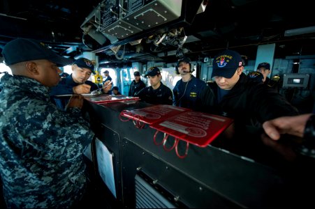 U.S. Sailors stand sea and anchor detail aboard the guided missile destroyer USS Ramage (DDG 61) as the ship arrives for a port visit at Naval Support Activity Souda Bay, Greece, Nov. 7, 2013 131107-N-VC236-006